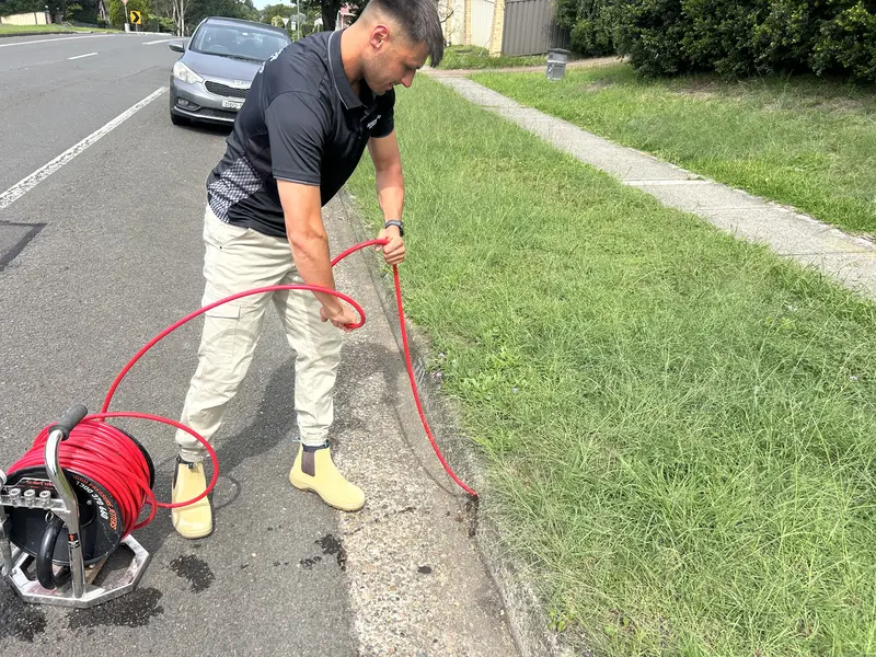 The CCTV drain camera feeding live footage from inside a blocked pipe